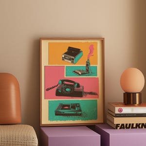 May include: A framed print with a retro design featuring a vintage phone, a record player, and a cassette player. The print is set against a colorful background with pink, yellow, and green panels.