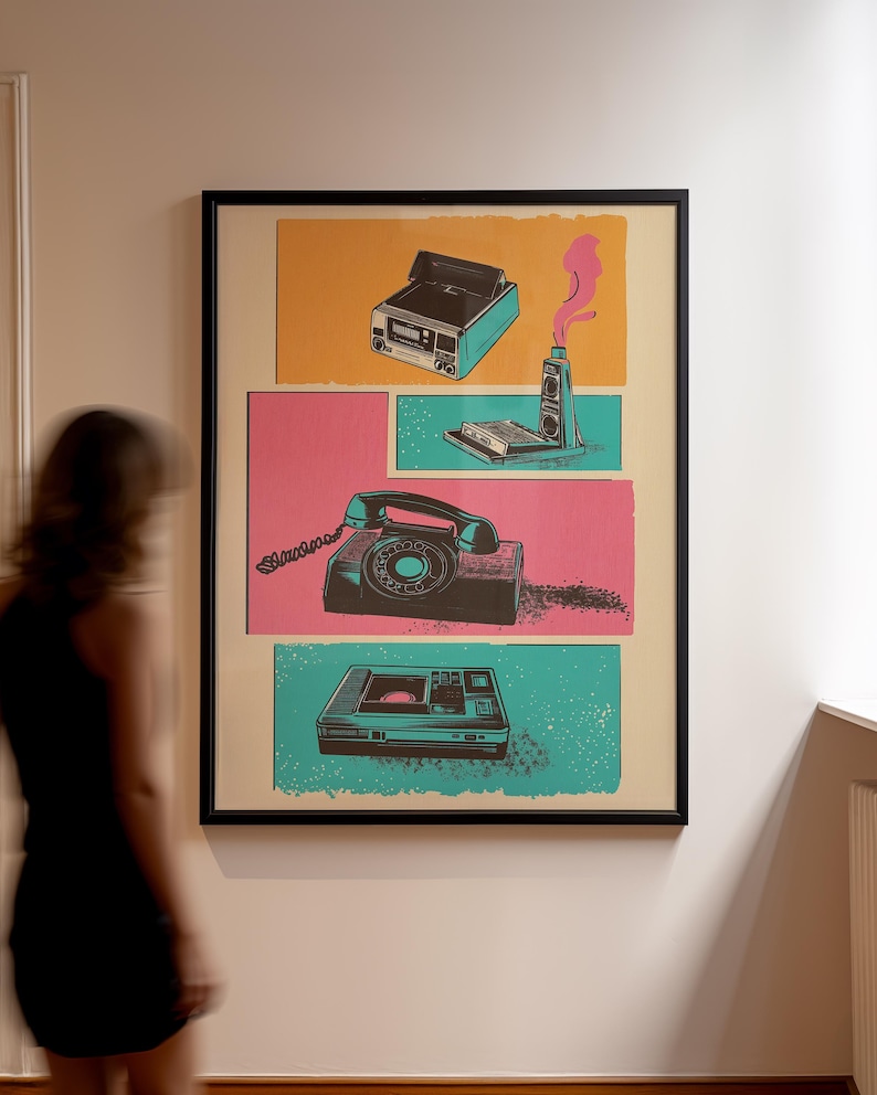 May include: A framed poster with a retro design featuring a vintage camera, a rotary phone, a cassette player, and a video cassette recorder. The poster is set against a background of pink, yellow, and blue.