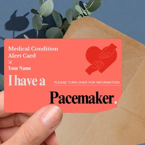 May include: A red medical alert card with a heart and hands graphic. The card reads "Medical Condition Alert Card", "Your Name", "I have a Pacemaker", and "Please turn over for information".