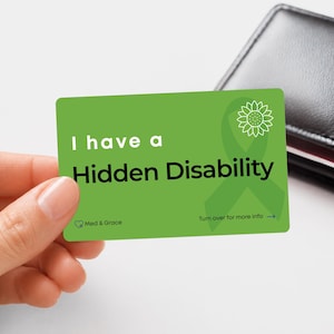 May include: A rectangular green card featuring the white text I have a Hidden Disability, a white sunflower icon, a green ribbon graphic, and the text Med & Grace and Turn over for more info with a blue arrow pointing to the right side.