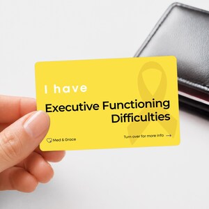 May include: A rectangular yellow card featuring the white text I have and black text Executive Functioning Difficulties. A yellow ribbon graphic is visible on the right side. The card includes the text Med & Grace and Turn over for more info.