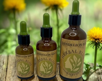 May include: Three amber glass bottles with droppers, labelled "Dandelion Root Herbal Bliss 100% Natural". The bottles are arranged in a row from largest to smallest on a wooden surface. The background is blurred and shows green foliage and yellow dandelion flowers.