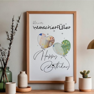 K&ouml;nnte beinhalten: Ein gerahmter Druck mit dem Text "kleiner Wunscherf&uuml;ller" und "Happy Birthday" in schwarzer Schrift. Zwei herzf&ouml;rmige Luftballons sind abgebildet, wobei einer einen 5-Euro-Schein und der andere einen 10-Euro-Schein enth&auml;lt, verziert mit Sternen.