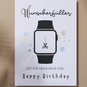 May include: A white rectangular greeting card featuring a black smartwatch illustration with a scissor icon on the screen. The text reads Wunscherf&uuml;ller, ZEIT F&Uuml;R DEINE NEUE UHR, and Happy Birthday, surrounded by small pastel-colored circles.