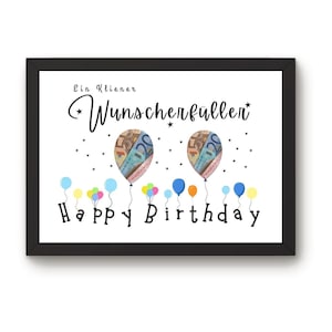 May include: A framed print with a white background features the text "Ein Kleiner Wunscherf&uuml;ller" and "Happy Birthday". Two balloons are designed with currency, and colorful balloons are at the bottom. The frame is black.