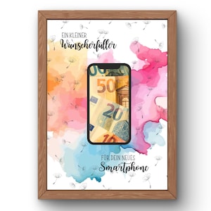 May include: A framed print featuring a smartphone graphic displaying Euro banknotes, surrounded by watercolor splashes in orange, pink, and blue, with dandelion seeds and the text "EIN KLEINER Wunscherf&uuml;ller F&Uuml;R DEIN NEUES Smartphone" in black script.