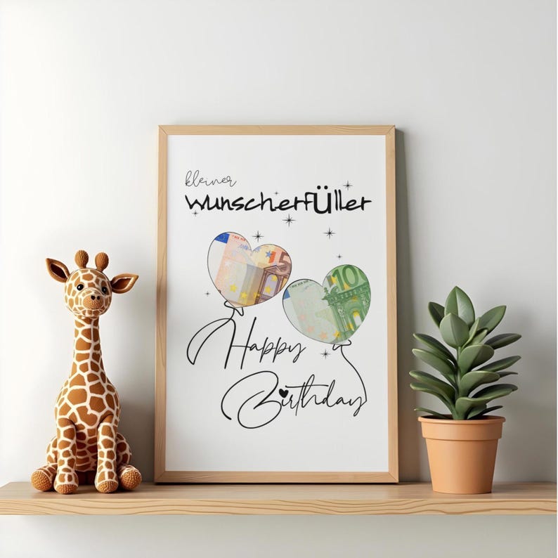 K&ouml;nnte beinhalten: Ein gerahmter Druck mit dem Text "kleiner Wunscherf&uuml;ller" und "Happy Birthday" in schwarzer Schrift. Zwei herzf&ouml;rmige Luftballons sind abgebildet, wobei einer einen 50-Euro-Schein und der andere einen 10-Euro-Schein im Inneren enth&auml;lt.