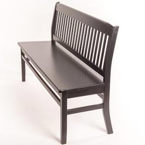 May include: A solid black wooden bench featuring a rectangular seat and a high backrest with vertical slats. The bench is supported by four straight legs connected by horizontal stretchers on the sides and front for structural stability.