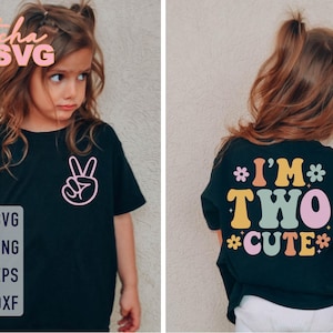 May include: Black t-shirt with a peace sign graphic on the front and the text "I'M TWO CUTE" on the back. The shirt has a retro design with colorful text and floral accents. The image also includes SVG, PNG, EPS, and DXF file formats.