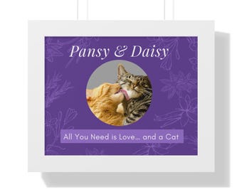 May include: A framed print featuring two cats in a circular image on a purple background. One cat is orange, the other is tabby. The text "Pansy & Daisy" is above the image, and "All You Need is Love... and a Cat" is below.