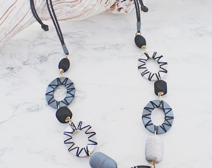 Long wooden disc and thread necklace