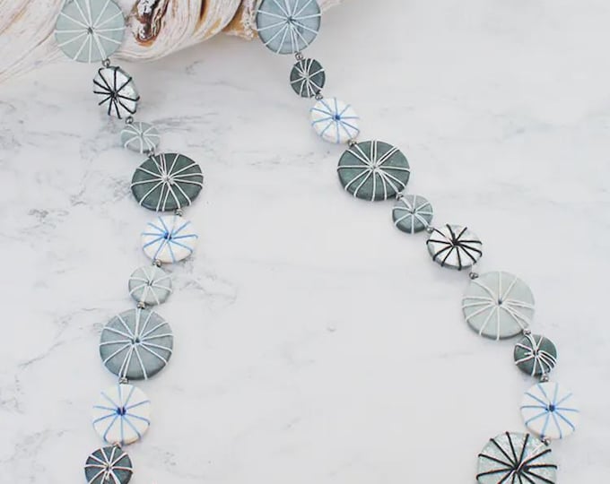 Long wooden disc and thread necklace