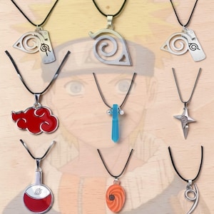 May include: Nine necklaces with different pendant designs, including a red cloud, a blue crystal, a star, and various stylized symbols in silver and red. Each necklace has a black cord.