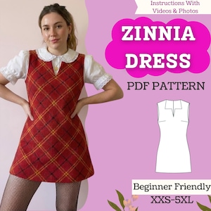 May include: A red plaid Zinnia dress with yellow accents is shown. The dress is worn over a white blouse with a Peter Pan collar. The image includes the text "Zinnia Dress PDF Pattern" and "Beginner Friendly XXS-5XL".