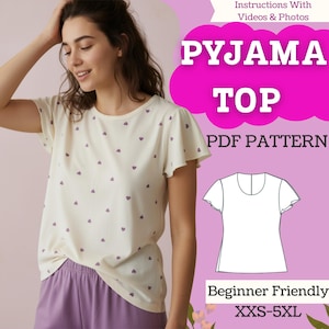 May include: A cream-colored pajama top with purple heart patterns and flutter sleeves. The image also shows a pair of purple pajama pants. Text on the image reads "PYJAMA TOP PDF PATTERN" and "Beginner Friendly XXS-5XL".