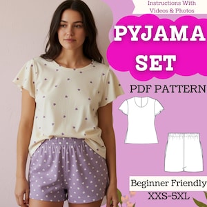 May include: A woman wearing a cream-colored pajama set with purple heart patterns. The set includes a short-sleeved top and shorts. The image also shows a pattern for the pajama set with the text "PYJAMA SET PDF PATTERN" and "Beginner Friendly".
