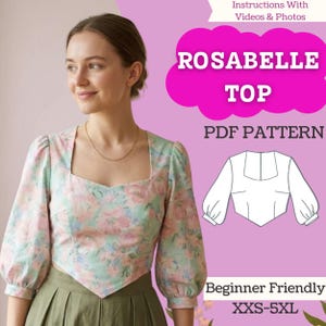 May include: A woman wearing a floral print top with a square neckline and puffed sleeves. The top is paired with a green skirt. Text on the image reads "ROSABELLE TOP PDF PATTERN" and "Beginner Friendly XXS-5XL".