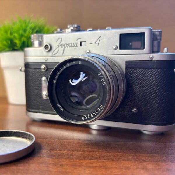 Working film camera, Camera Zorki 4, vintage Soviet camera for photographers, camera with Jupiter8 lens, vintage Soviet-made camera.