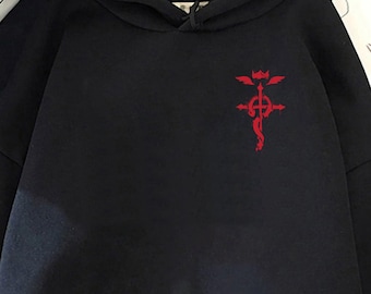 May include: Black hooded sweatshirt with a front pocket and a red emblem on the chest. The sweatshirt has long sleeves and a drawstring hood. The emblem is a stylized design.