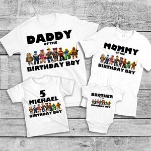May include: White t-shirts with black text and colorful character graphics. The shirts read "Daddy of the Birthday Boy," "Mommy of the Birthday Boy," "5 MICHAEL Birthday Boy," and "Brother of the Birthday Boy."