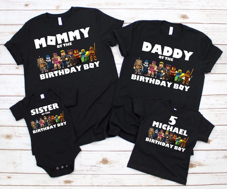 May include: Black t-shirts and a onesie with white text and colorful character graphics. The shirts read "Mommy of the Birthday Boy," "Daddy of the Birthday Boy," and "5 Michael Birthday Boy." The onesie says "Sister of the Birthday Boy."