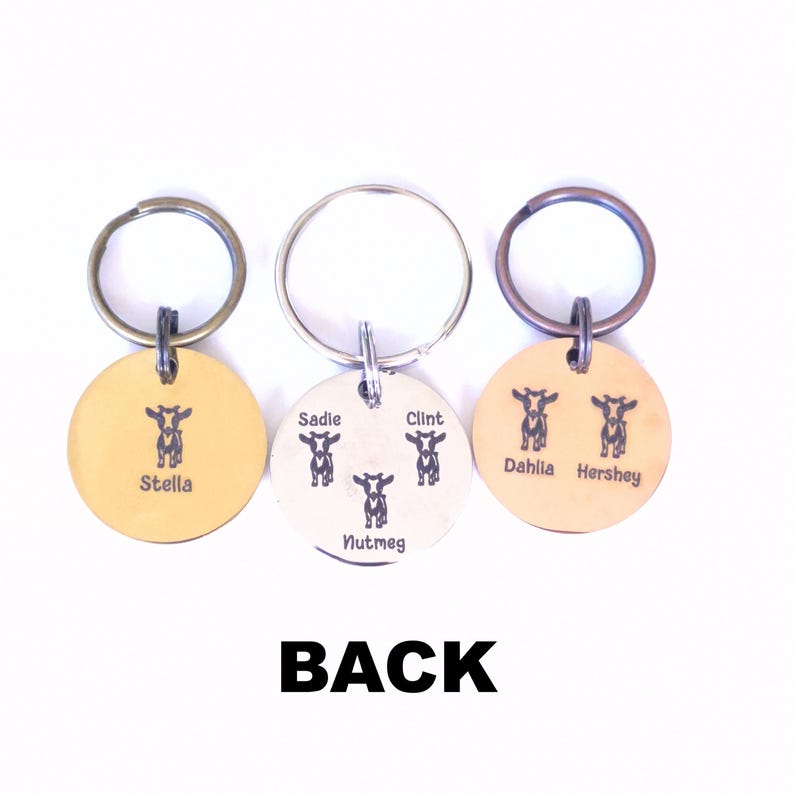 May include: Three personalized pet ID tags with key rings. The tags are round, with a cow graphic and names: "Stella", "Sadie", "Clint", "Nutmeg", "Dahlia", and "Hershey". The word "BACK" is printed in bold, black letters.