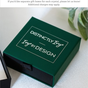 DistinctlyIvy green drawer gift box on white fabric with green leaves in the background