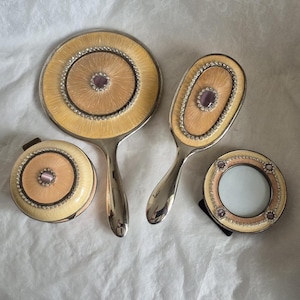Vintage 4 piece silver, peach and yellow enamel vanity set, embellished with diamanté stones, mirror, brush, compact and photo frame.