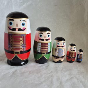 Set of 5 hand painted wooden Russian dolls in Nutcracker style designs - 14cm tall