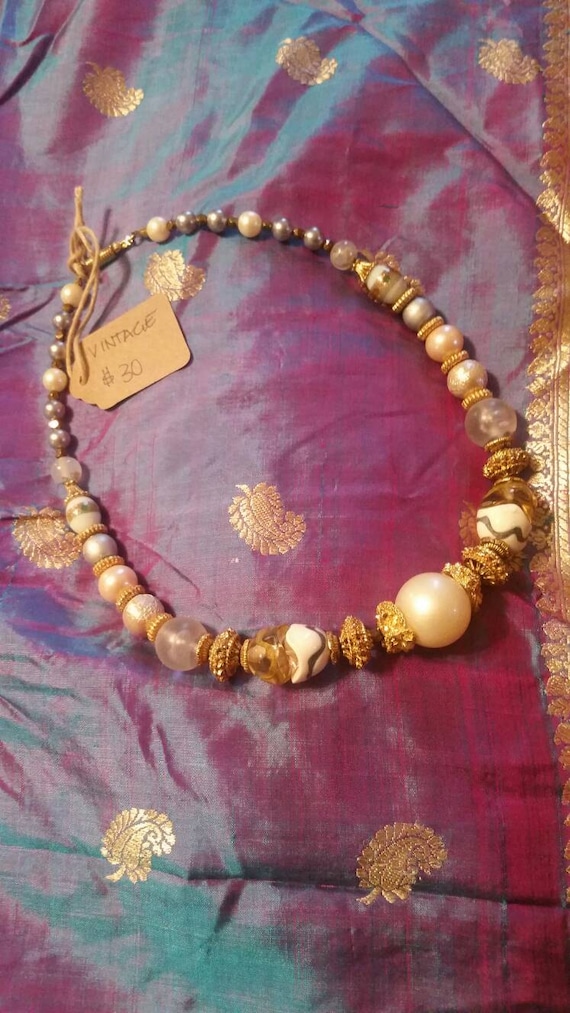 ivory and gold beaded Gem