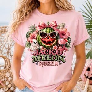 May include: Pink t-shirt featuring a watermelon design with sunglasses, a carved face, and a pink bow. The shirt also has a ghost, flowers, and the text "JACKO MELON QUEEN".