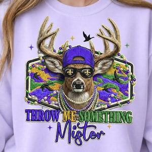 May include: A lilac sweatshirt with a deer graphic wearing a purple cap, sunglasses, and a pearl necklace. The deer is within a decorative frame, with the text "THROW ME SOMETHING Mister" in purple and green.