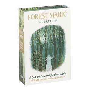 May include: A rectangular box set titled Forest Magic Oracle, A Deck and Guidebook for Green Witches by Nikki Van De Car, illustrated by Elin Manon. The white box features a green forest illustration with a figure holding a wand.