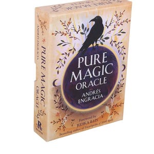 May include: A rectangular box for the Pure Magic Oracle deck by Andrés Engracia. The cover features a black raven silhouette against a purple circular background, surrounded by tan foliage illustrations and the text Pure Magic Oracle.