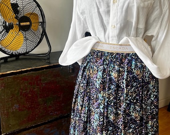 ESCADA  softly pleated midi skirt, graphic print with signature logo scattered  throughout. Sz. S