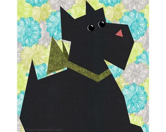 May include: Black silhouette of a Scottish Terrier dog with a green and brown collar against a background of blue, green, and gray floral fabric.