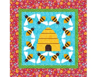 May include: A colorful quilt block with a beehive and bees. The beehive is yellow and brown with a brown entrance. The bees are yellow and black with white wings. The background is blue with a white pattern. The border is red with a floral pattern.