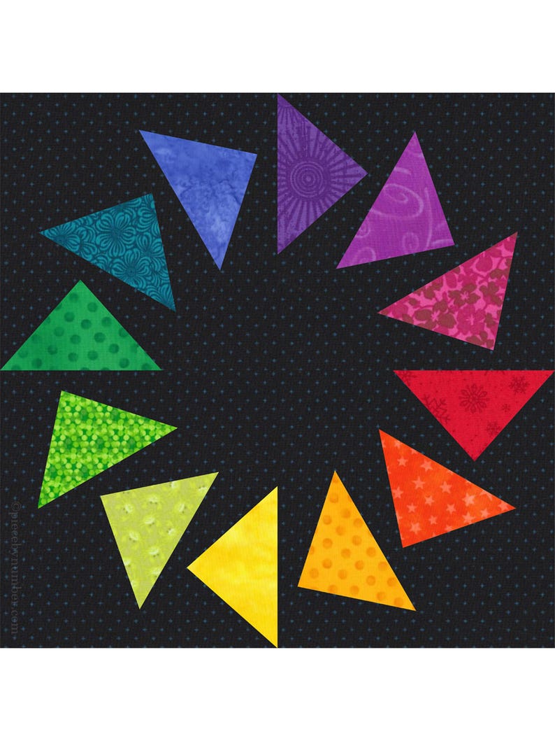 May include: A quilt block featuring twelve triangular fabric pieces arranged in a circular pattern on a black background with small white dots. Each triangle displays a different color and pattern, including floral, geometric, and star motifs.