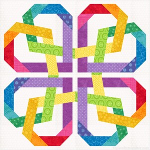 May include: A colorful quilt block with a geometric design featuring a rainbow of colors, including red, orange, yellow, green, blue, and purple. The design is made up of multiple strips of fabric that are woven together to create a complex pattern.