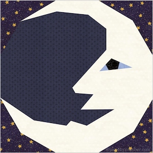 May include: A white crescent moon with a blue eye on a dark blue background with gold stars.
