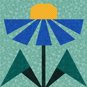 Black-eyed Susan, paper piecing flower quilt block pattern, PDF download, 6 & 12 inch, resizable, foundation piecing FPP.  The image shows one possible color scheme for the Black-Eyed Susan quilt block, with blue petals, golden-yellow center and dark green leaves on a medium green background.