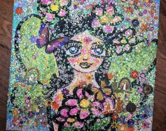 May include: A colorful, glittery painting of a girl with flowers in her hair and a butterfly in her hand. The background is a mix of green, blue, and pink glitter.