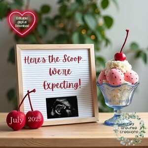 May include: A white letter board with the text "Here's the Scoop... We're Expecting!" and a July 2025 date. A black and white ultrasound image is on the board. A glass sundae dish with a cherry on top and pink and white ice cream is on a wooden table.
