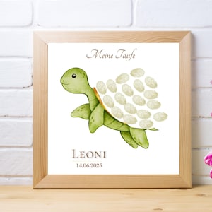 May include: A green watercolor turtle with a white shell. The shell is decorated with white fingerprint spaces. The text "Meine Taufe" is at the top of the image. The text "LEONI 14.06.2025" is at the bottom of the image.