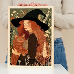 Herbsthexe mit roten Haaren hält eine Katze Poster – Florales Cottagecore Fantasy Porträt – Magische Natur-Themen Wand Kunst-Druck
