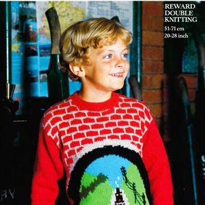 May include: A red knitted sweater with a brick pattern on the shoulders and a train scene on the front. The sweater is designed for double knitting and fits a chest size of 20-28 inches.