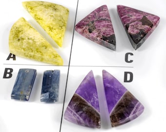 May include: Four sets of gemstone cabochons, labeled A through D. Set A is two pieces of yellow-green stone, set B is two pieces of blue stone, set C is two pieces of pink stone, and set D is two pieces of purple stone.