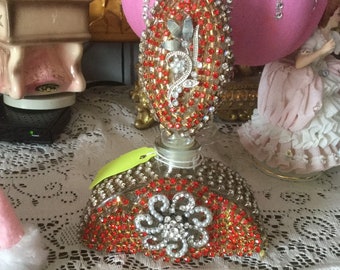 Jeweled perfume bottle in red jewels