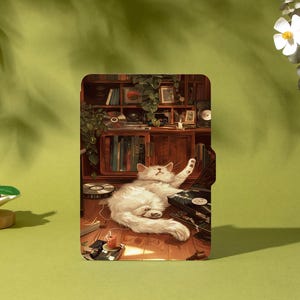 May include: A tablet case featuring a detailed illustration of a white cat lounging on a wooden floor next to a record player. The background shows a bookshelf and a vintage cabinet. The case has a green background and the word "Shadeify".