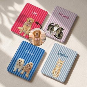 May include: Four rectangular metal cases with vertical stripes, each featuring a custom pet portrait and a name or initials. The top left case is red with MK, top right is pink with Hannah, bottom left is blue with Olivia, and bottom right is light blue with Sophia.